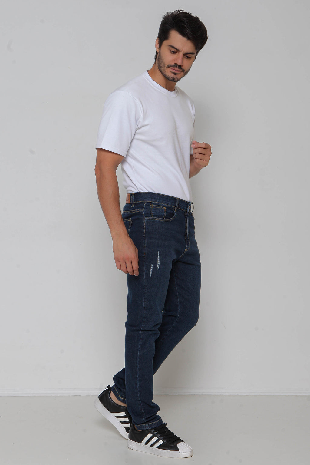 Calça Jeans Masculina Skinny Escura com Puídos